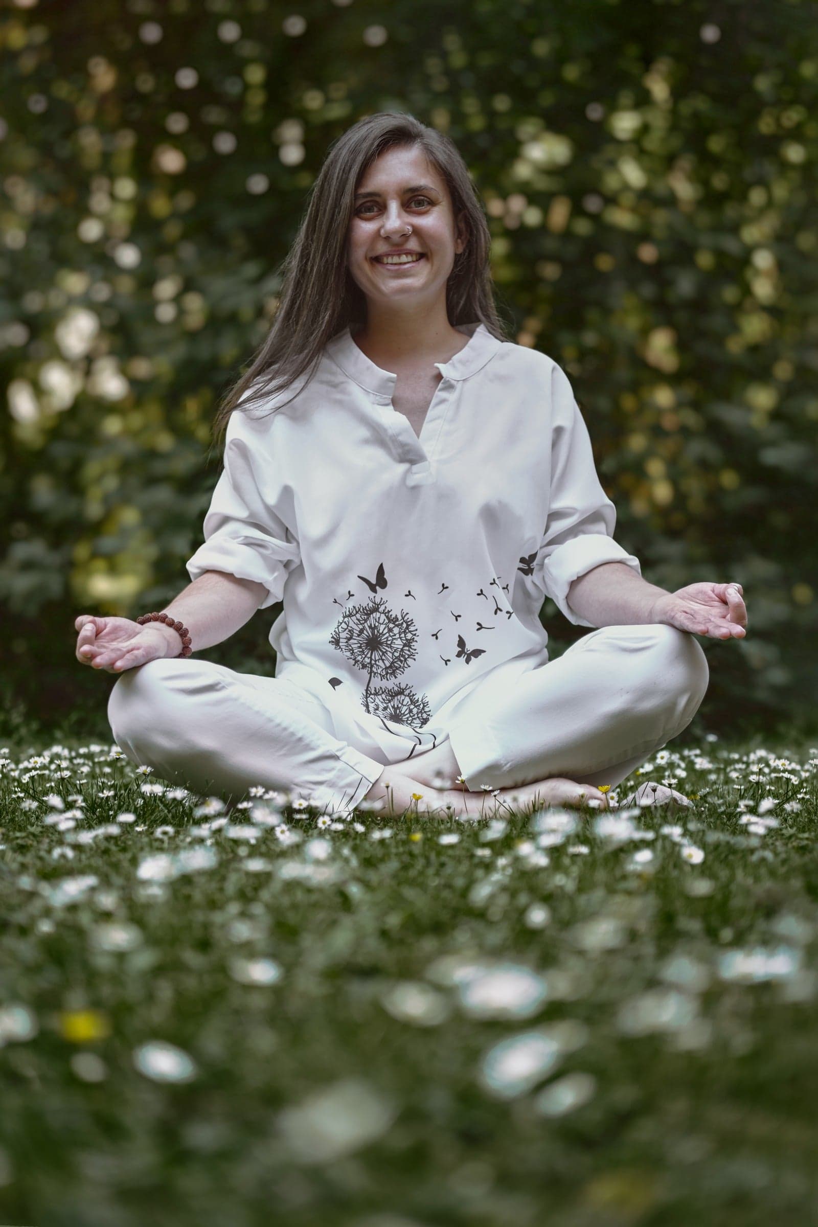 Elis meditating in a meadow